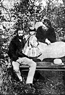 Maria with her parents in 1873.