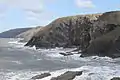 Looking towards Cemaes Head from Ceibwr Bay to the south.  The contorted strata is evident.