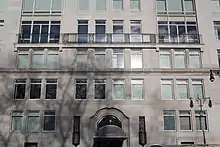 The main entrance to the "House" section, a curved limestone doorway on Central Park West