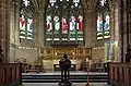 High altar, reredos Last Supper carved by H.H. Martyn of Cheltenham, stained glass designed by Edward Burne-Jones and executed by William Morris