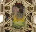 Ceiling frescoes seen straight upwards.