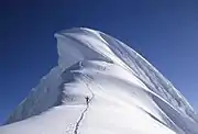 Giant cornice on top of the Chopicalqui (6.345 m) in the Andes in Peru