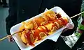 Corn dogs from a Christmas tianguis in the streets of Colonia Industrial, Mexico City