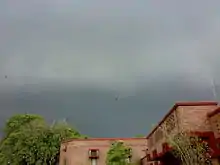 Monsoon clouds over city