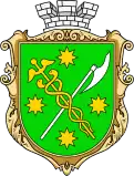 Vert bordure or, a caduceus or and an axe argent saltirewise, four octagrams or in chief, in base and in fess, and overall surmounted by a mural crown argent.