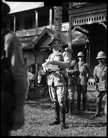 Colonel Robert Logan reading a proclamation in Apia, Samoa, on 29 August 1914, the day he assumed responsibility as military administrator.