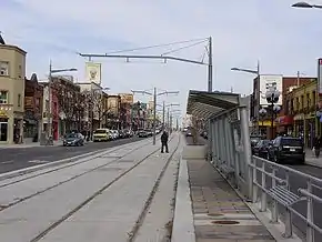 Looking east on St. Clair Avenue West in Corso Italia in 2009 with the nearly completed streetcar right-of-way in the centre