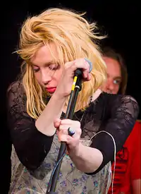 Colour photograph of Courtney Love performing live in 2010