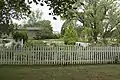 A garden and the Ackley Covered Bridge