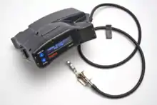 A photograph of a black apparatus with a digital readout.