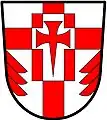 a cross enhanced - Argent; a cross enhanced gules, over all a billet charged with a cross pattée fitchée, all counterchanged and in base issuant from each flank a demi fir tree in pale gules - St. George's Church Pickering Village, Canada