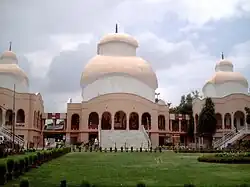 Kali mandir facade, from the main access direction, with Shiva (left) and Radhakrishna (right) temples.  The temples themselves open on the other side.