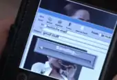 A sexual image of a women on a palm pilot