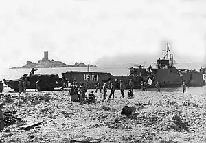 Île d'Or from the NNW, as American soldiers disembark a landing craft (August 1944)