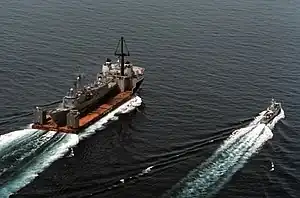 MV Mighty Servant 2 carries USS Samuel B. Roberts from Dubai to Newport, R.I., in 1988.