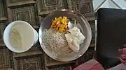 Dahi and chura served separately along with fruit