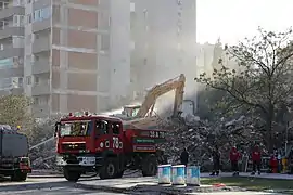 Removal of debris from the Yılmaz Erbek Apartman in November. Eleven people died.