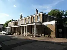 The Colonnade (houses and offices) by the main gate.