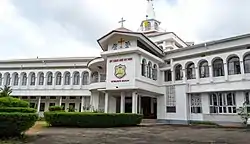 Large, white two-storey building