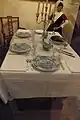 Dinner table set for the regents of the Coen Cuser Stichting, the Haarlem orphanage that is now defunct, but was formerly located on the Olieslagerslaan