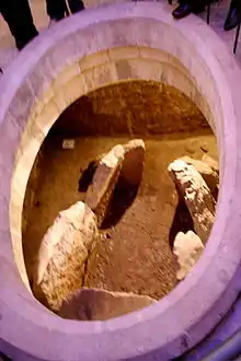 The dolmen, now visible through the chapel floor.