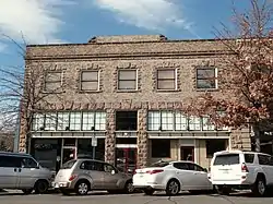 Photograph of the Downing Building, a two-story, stone commercial building