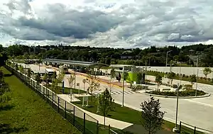 A bus station with numerous bus bays viewed from above