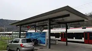 Platform with canopy and white single-level train