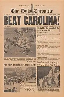 The front page of The Duke Chronicle, featuring the very large headline "BEAT CAROLINA!" and showing photos from the previous year's game including a scramble after a fumble, a pep rally crowd, and a bonfire