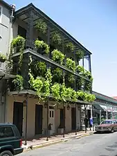 Simple posts on the first floor and more ornate on upper floors