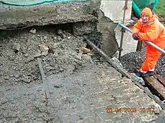 A hydrodemolition operative in protective clothing