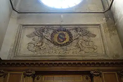 Stone carving below rose window in the transept