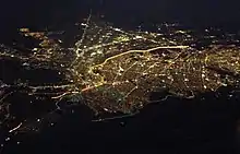 Aerial view of El Paso, Texas and Ciudad Juárez, Chihuahua; the brightly lighted border can clearly be seen as it divides the two cities at night.