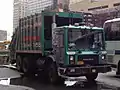 Rear loading refuse truck