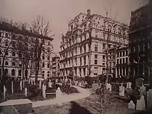 Photograph looking northeast from Trinity churchyard across Broadway, at the Equitable Life Assurance Building in 1870