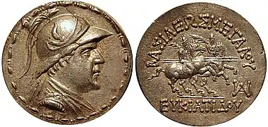 Silver tetradrachm of King Eucratides I (171–145 BC). Obv: Bust of Eucratides, helmet decorated with a bull's horn and ear, within bead and reel border. Rev: Dioscuri, each holding palm in left hand, spear in right hand. Greek legend: ΒΑΣΙΛΕΩΣ ΜΕΓΑΛΟΥ ΕΥΚΡΑΤΙΔΟΥ "Of Great King Eucratides". Mint monogram below. Diameter 34 mm, weight 16.96 g, Attic standard.