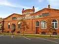 Reeves Peanut Company, the Renaissance Revival-style warehouse was built by the Eufaula Grocery Company in 1903.