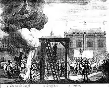 A gallows is in the centre of the image, to its left a large bonfire; a crowd watch