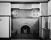 Fireplace, living room. Note that above the fireplace there is an optical illusion that there is no chimneystack, Wright used a mirror for this purpose