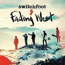 The cover to Fading West is all of the band members standing on a sandy mountain.