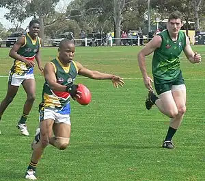 South African player kicks the ball against Ireland