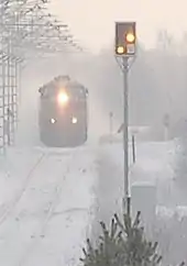 A Finnish distant signal at the western approach to Muhos station is displaying Expect Stop.