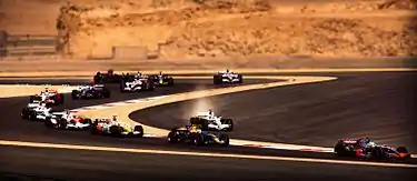 The First lap of the 2008 Bahrain Grand Prix with Jenson Button leaving the track