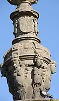 Detail of spouts, showing figures and coat-of-arms