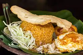 Nasi goreng with chicken, egg and prawn cracker