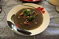 Frijol con puerco (beans with pork) prepared with beans, pork, epazote, onion, cilantro, lemon, radishes and habanero chile.