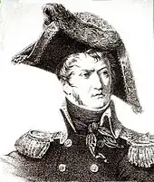 Black and white print of a frowning man with long sideburns. He wears a dark military uniform and an enormous bicorne hat.