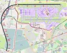 A map of the Heathrow airport area, with a curved solid black line starting from the northern runway and ending southwest of the airfield; red numbers from 0 to 150 are marked along the black line.