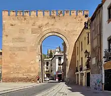 A beige-coloured city gate