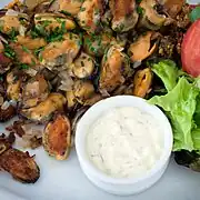 Gebakken mosselen (fried mussels) with butter and onions.